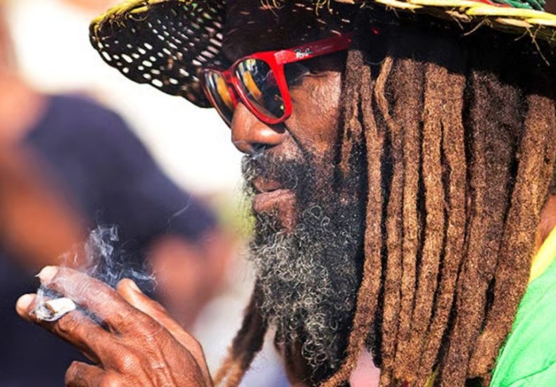 Image of a Rasta smoking hot graba Jamaican Graba Culture, Jah Livity Hot Graba, online cannabis dispensary in negril