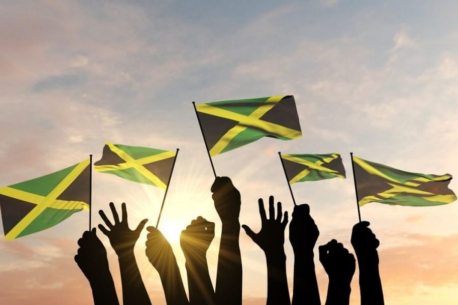 Idependece Day in Jamaica, Independence, Emancipation, Image of hands holding jamaica flags