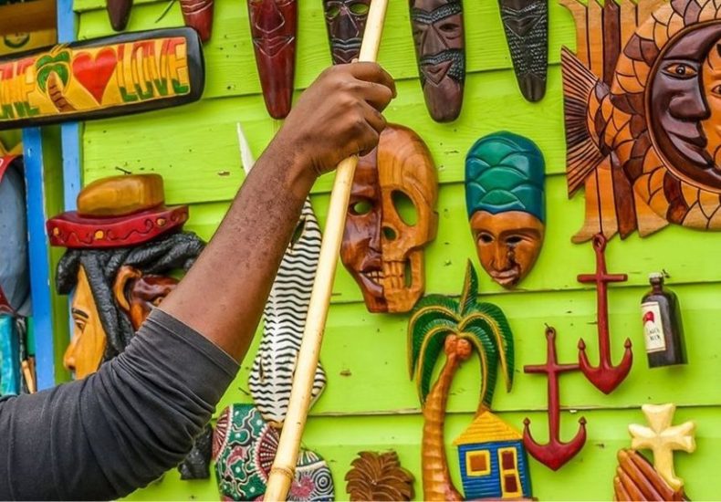 Shohp Local in Jamaica, Online Cannabis Dispensary in Negril, weed delivery, Image of a carver and his wares