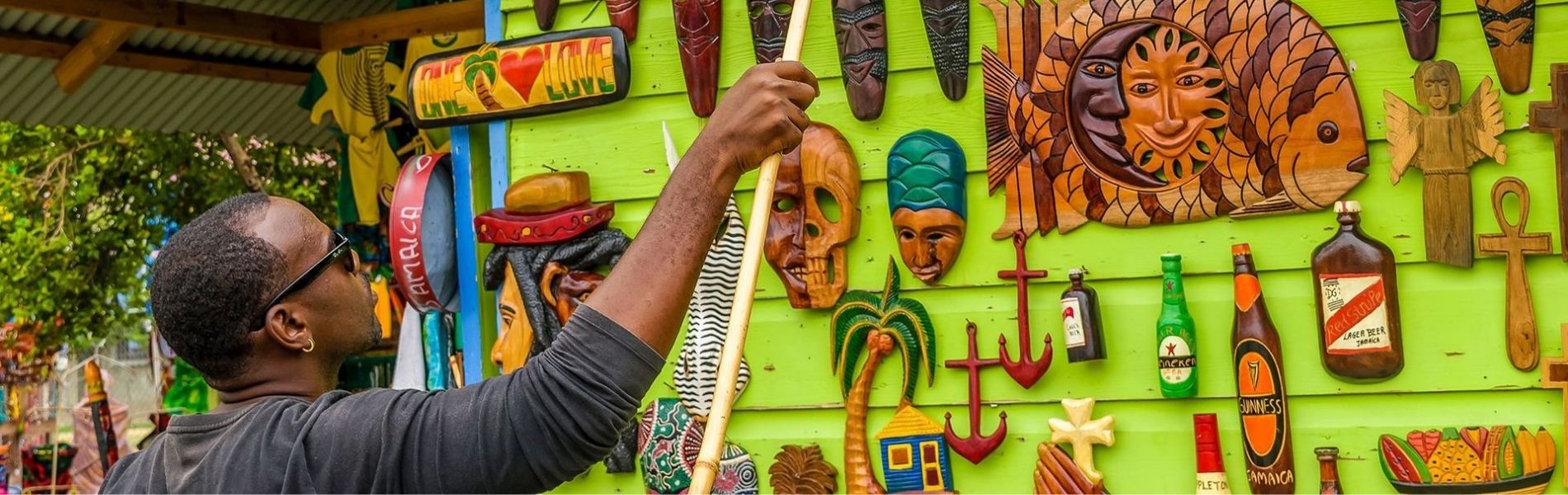 Shohp Local in Jamaica, Online Cannabis Dispensary in Negril, weed delivery, Image of a carver and his wares